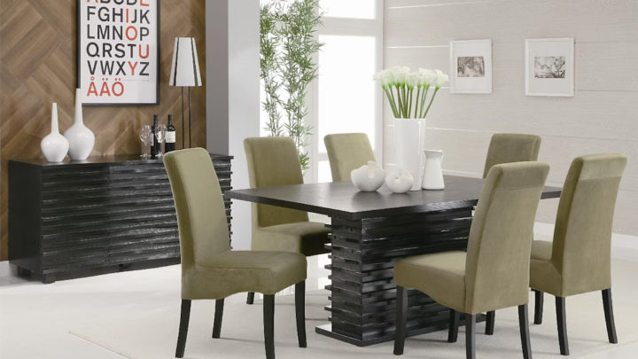 Coaster Casual Dining Stanton Rectangular 66-inch Dining Table in Black (102061) at Payless Furniture, featuring a modern black wood table with a slatted base, complemented by six olive-green upholstered chairs in a contemporary dining room setting. The space includes a sideboard, minimalist decor, and natural lighting.
